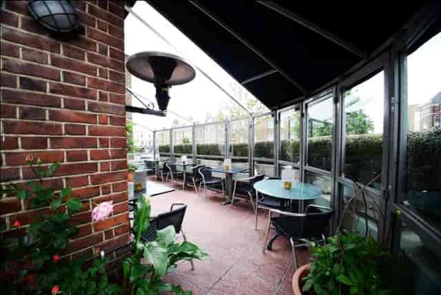 The Terrace Room at The Chapel Bar: cozy outdoor venue for gatherings and events.