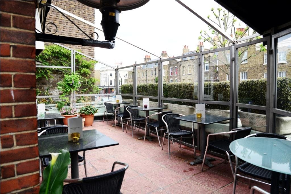 Charming outdoor terrace at The Chapel Bar, ideal for casual meetings and networking events.