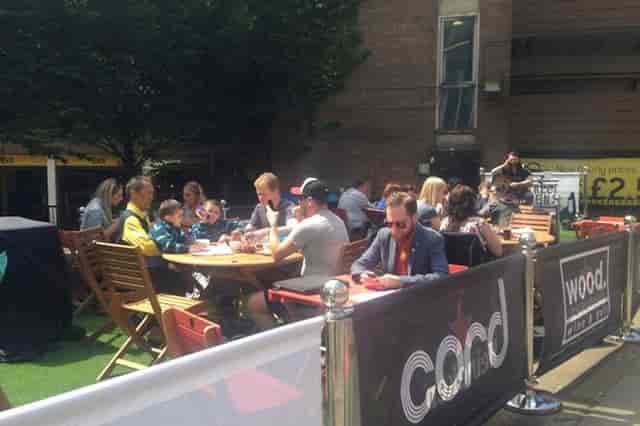 Vibrant outdoor venue in Tib Street Garden for casual networking and social events.