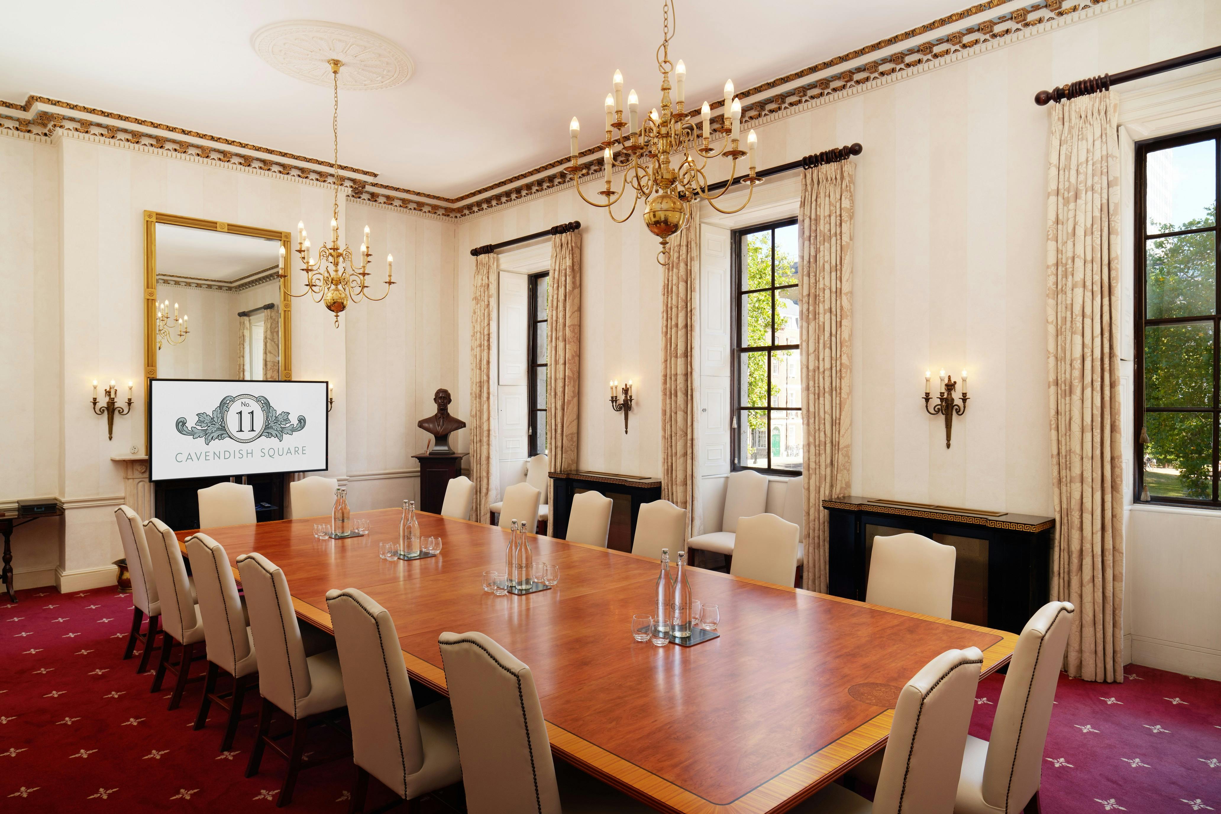 Elegant meeting room with wooden table, ideal for corporate gatherings and executive retreats.