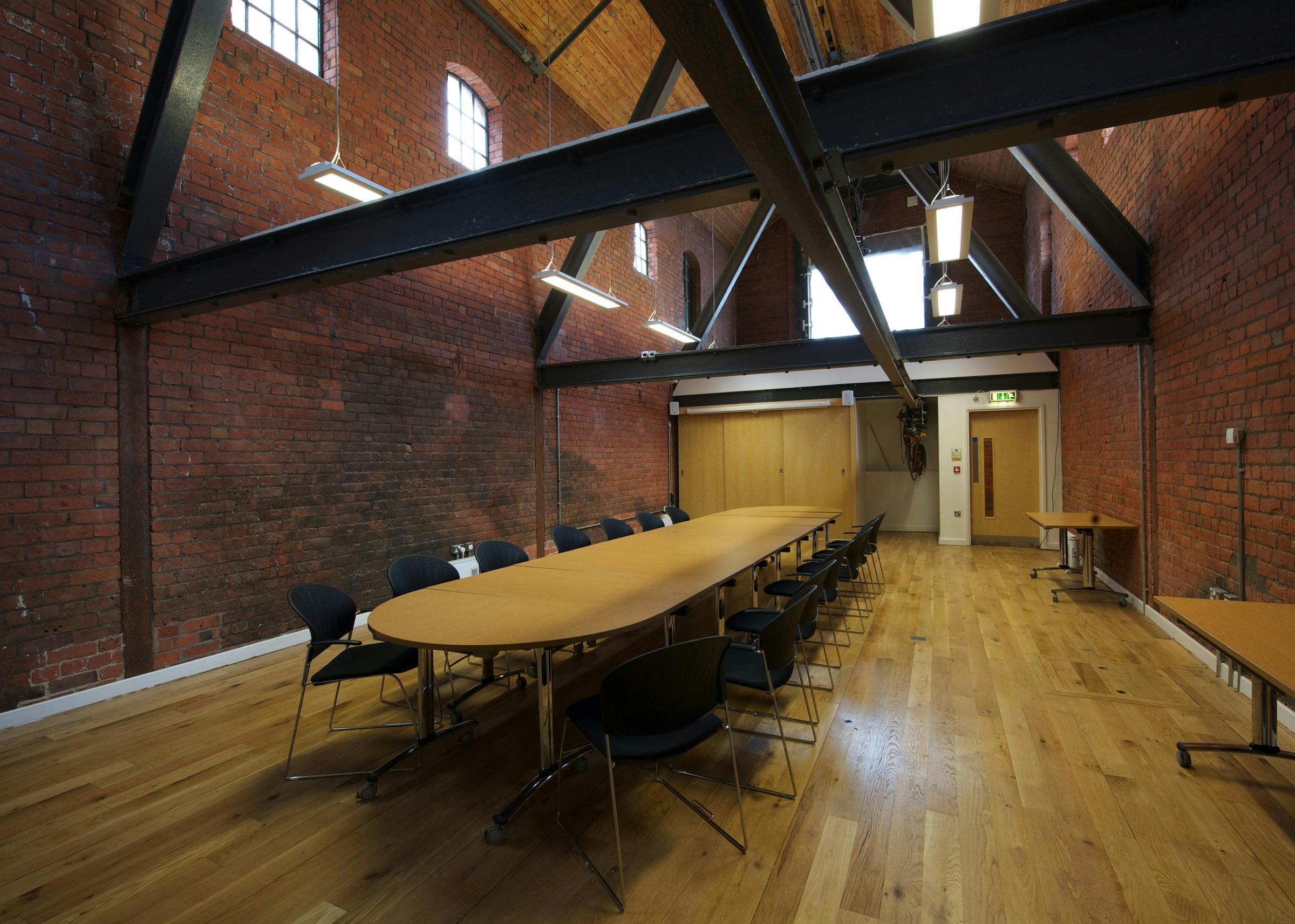 Coal Store Conference Room with exposed brick, ideal for workshops and team meetings.