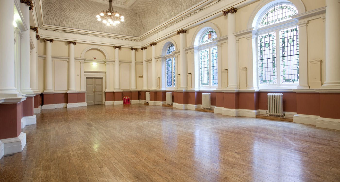 Shoreditch Town Hall Council Chamber, spacious event room with large windows for natural light.