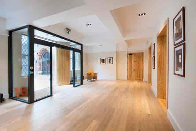 Modern meeting room foyer with natural light, ideal for networking events.