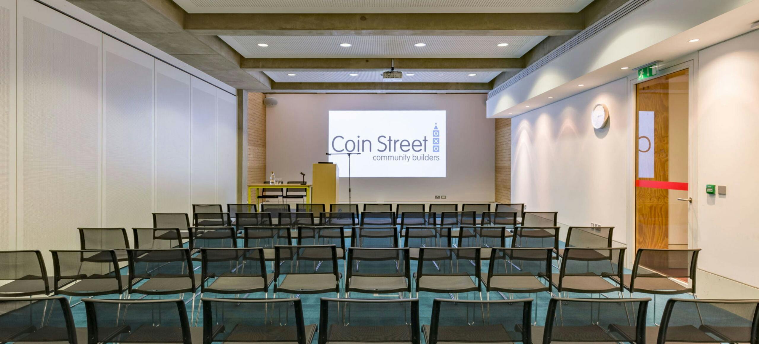 South Bank Suite meeting space with projector screen, ideal for conferences and events.