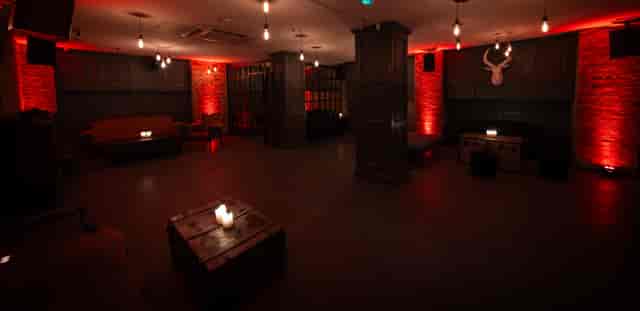 Intimate event space at The Secret Bar with rustic decor, ideal for private gatherings.