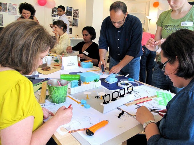 Dynamic workshop at The Make Lounge with engaged participants and hands-on activities.