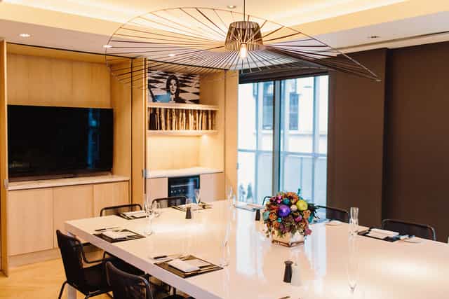Modern meeting room at South Place Hotel with sleek table, ideal for corporate events.