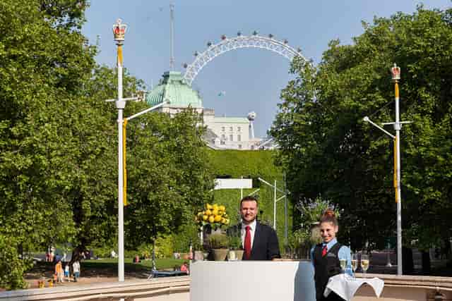 Outdoor event setup at The Royal Society with staff and London Eye backdrop.