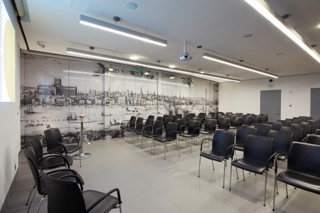 Modern conference suite with black chairs and artistic mural for events and presentations. - Banner