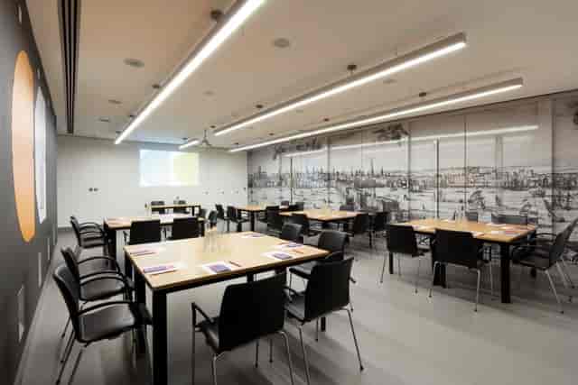 Modern conference suite with ergonomic chairs, ideal for meetings and events.