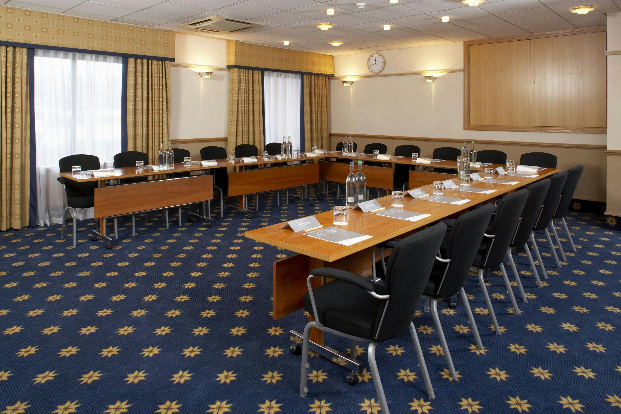 Dorval Suite meeting room at Hilton Manchester Airport with U-shaped table setup.