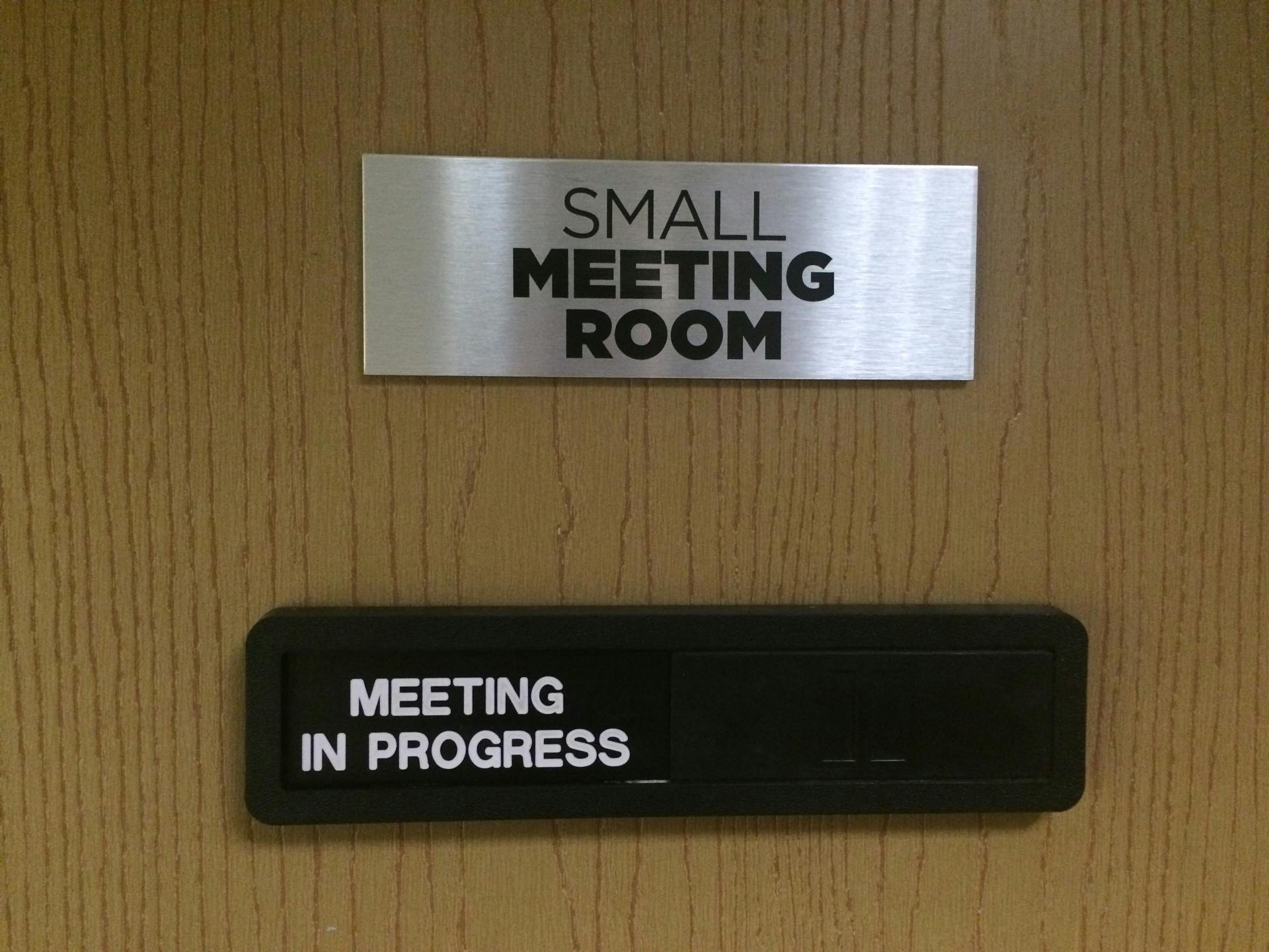 Small Meeting Room sign at The Message Enterprise Centre, indicating "Meeting in Progress."