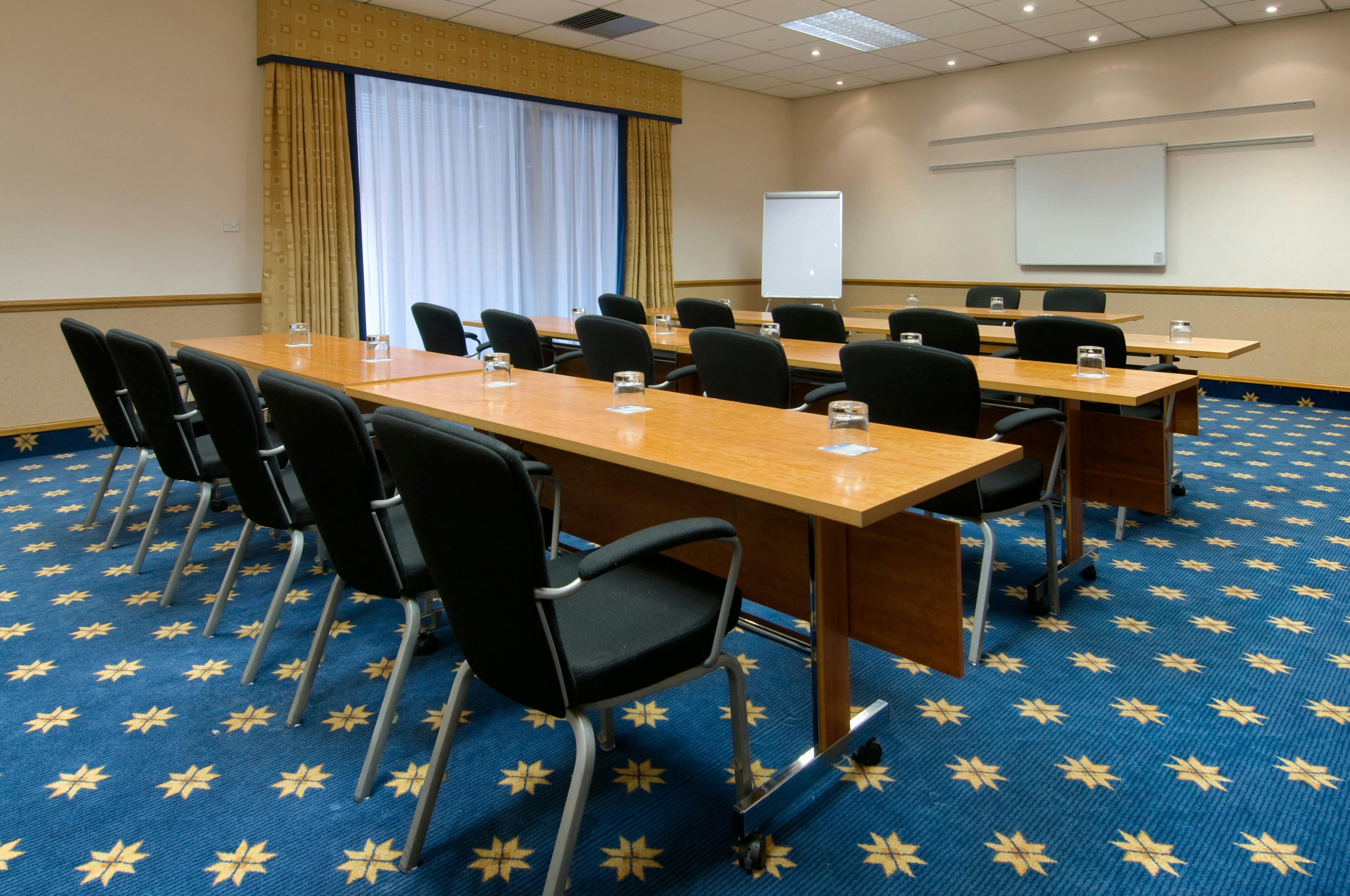 Hanover Suite meeting room at Hilton Manchester Airport with U-shaped table setup.