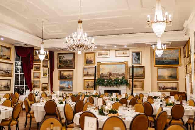 Boleyn Banqueting Suite: Elegant crystal chandeliers for a formal wedding reception gala.