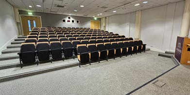 Cotton Theatre auditorium with tiered seating for conferences and presentations.