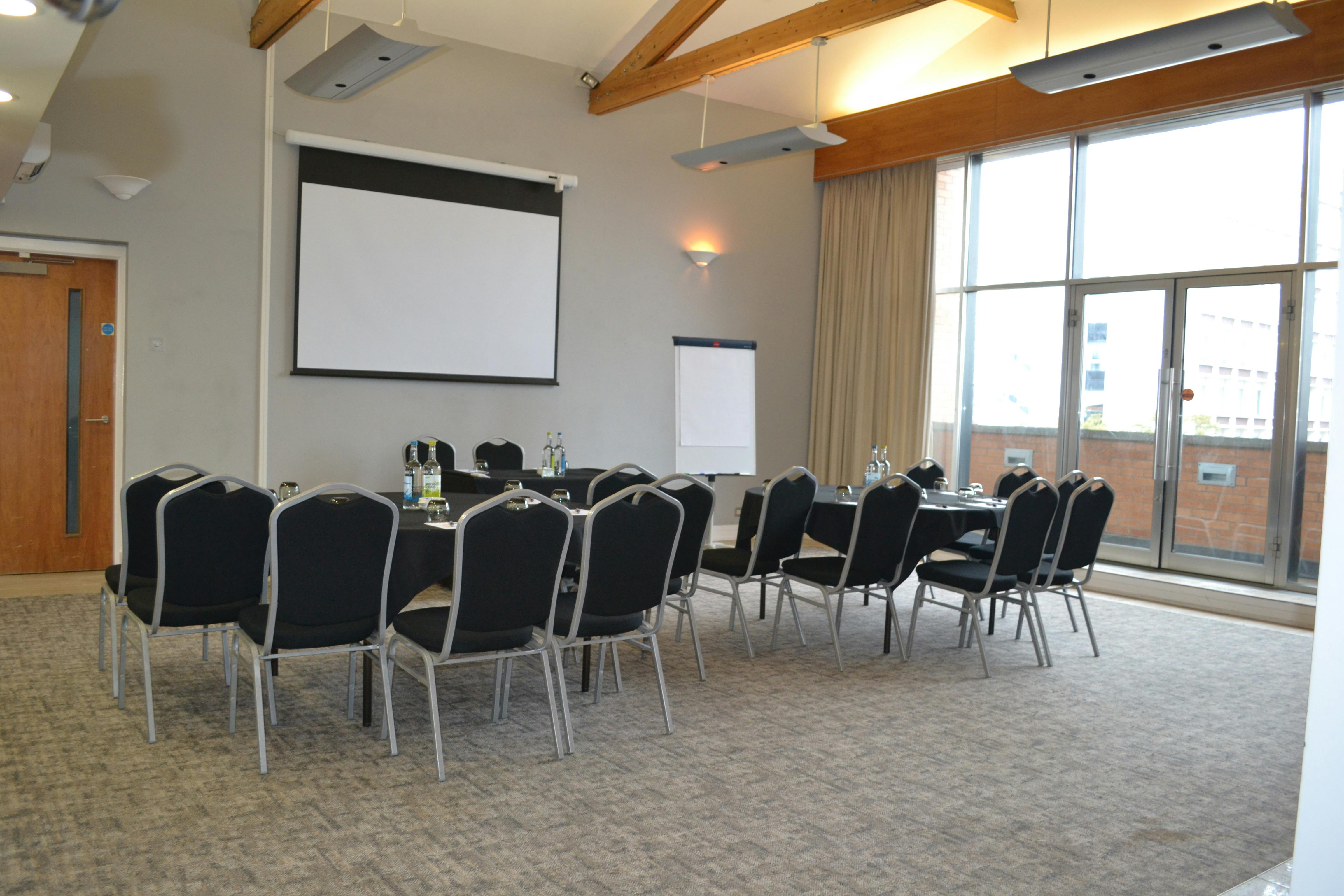 Edgerton Suite meeting room with U-shaped seating, ideal for conferences and presentations.