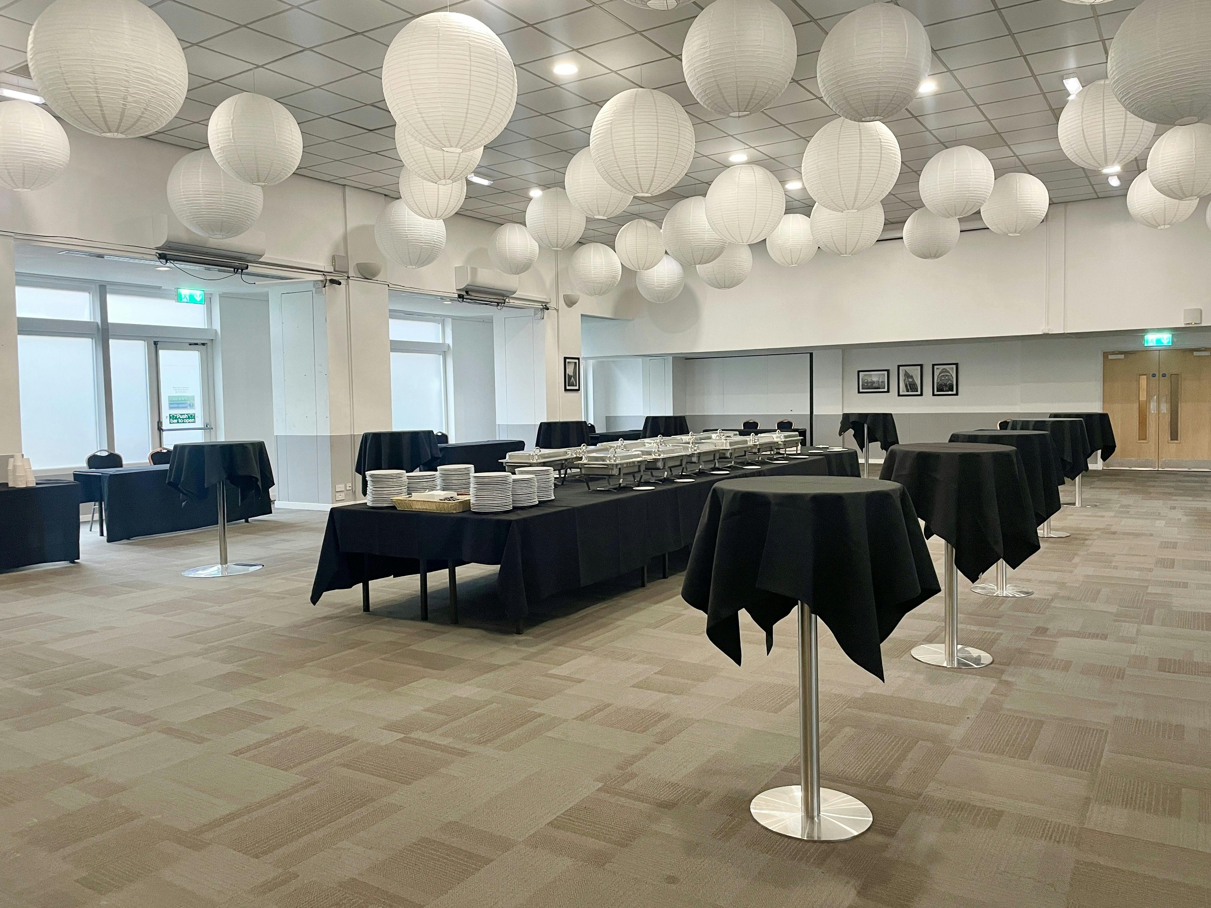 Pioneer Room at Manchester Conference Centre, elegant tables for networking events.