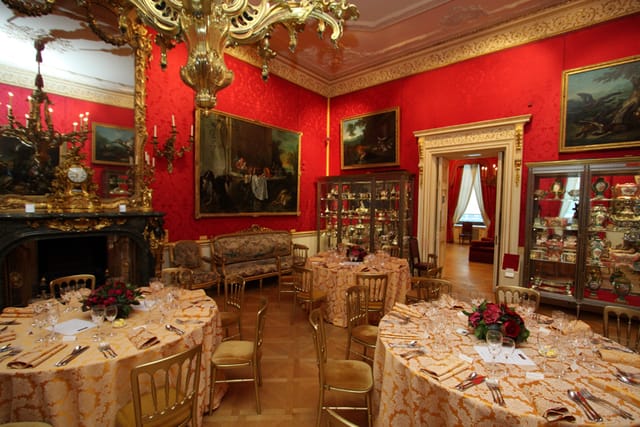 Elegant event space with round tables, ideal for corporate events and upscale celebrations.