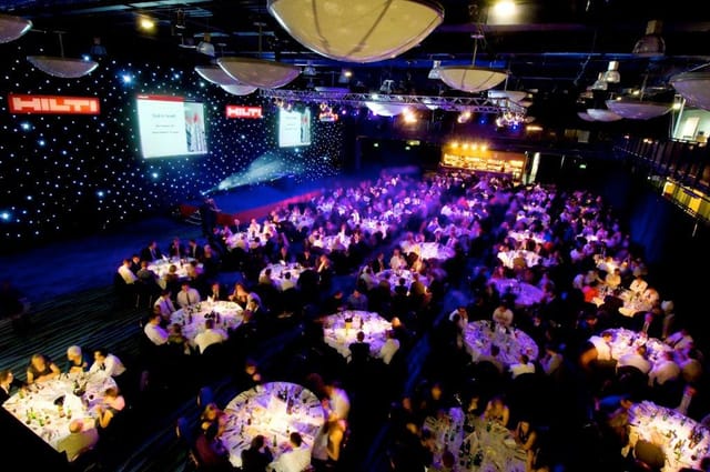 Premier Suite at Bolton Whites Hotel, elegant tables for corporate event with ambient lighting.