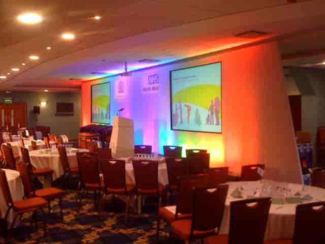 Platinum Suite at Bolton Whites Hotel, set for a vibrant conference with round tables.
