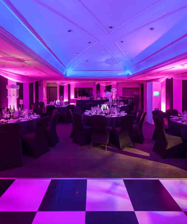 Elegant event space at The James Watt, featuring purple lighting for upscale gatherings.