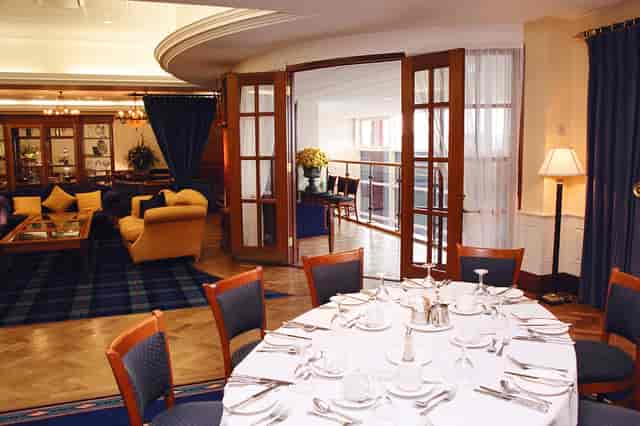 Chairman's Suite at Bolton Whites Hotel with elegant dining setup for events and gatherings.