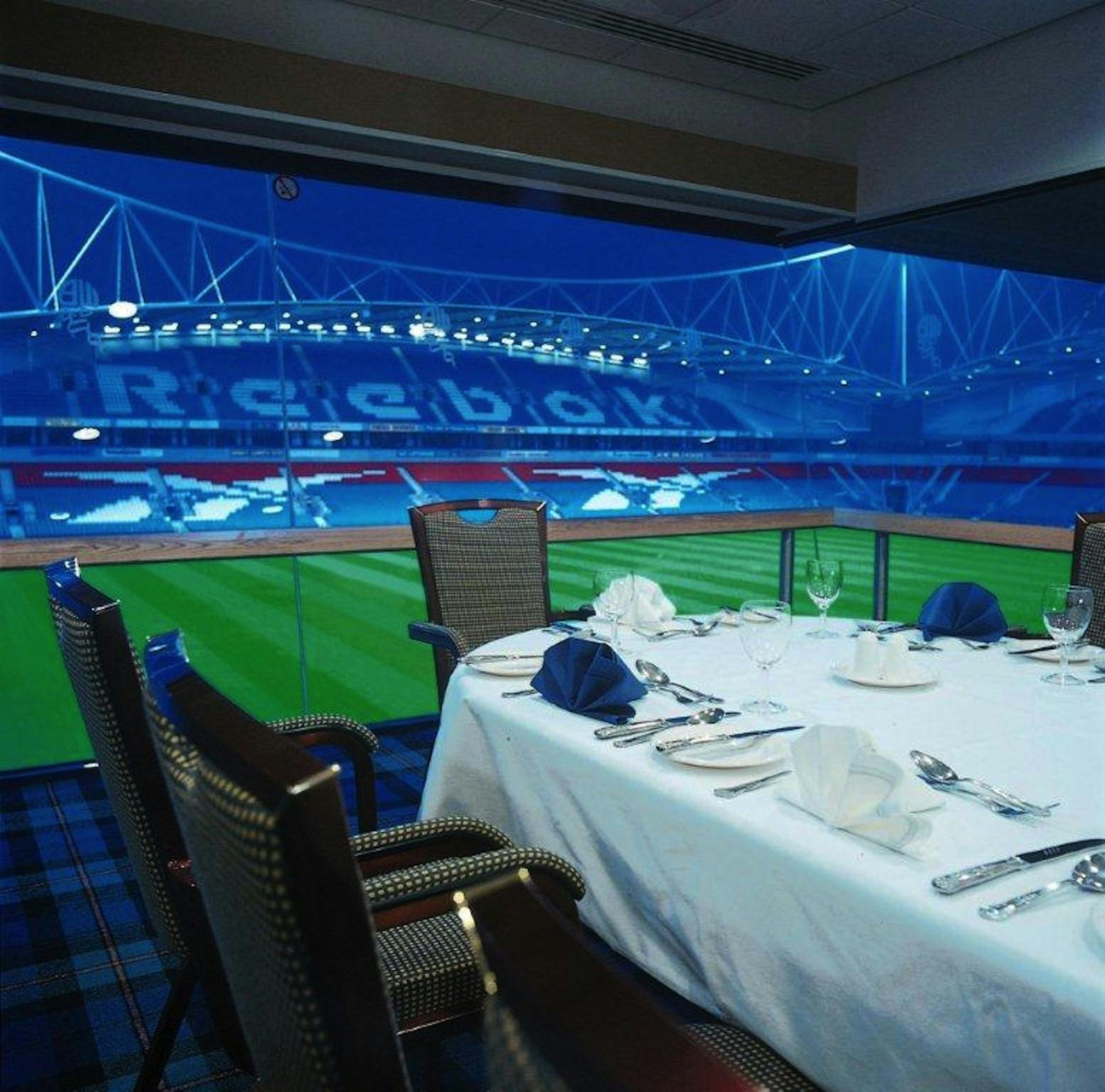 Executive Corner Box at Bolton Whites Hotel with elegant dining setup for corporate events.