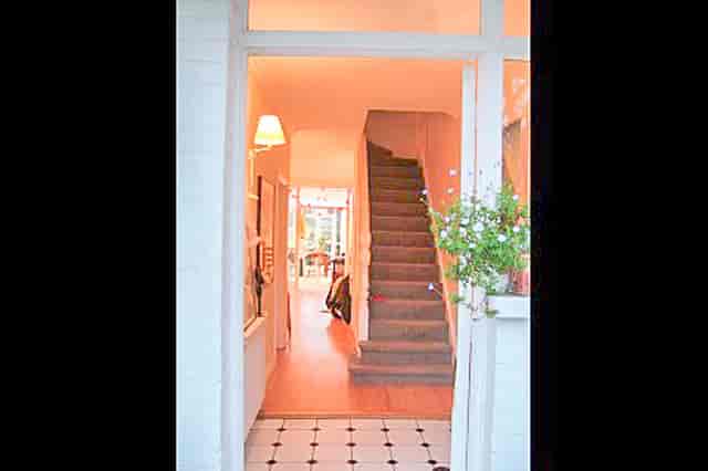 Inviting entrance in contemporary family house, perfect for intimate gatherings and events.