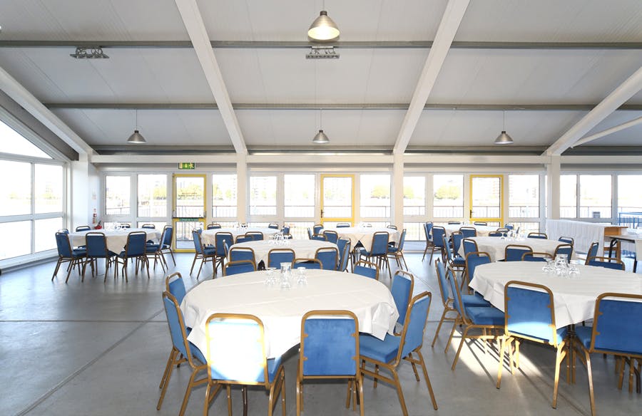 Sir William Boreman Hall with round tables, ideal for weddings and conferences.