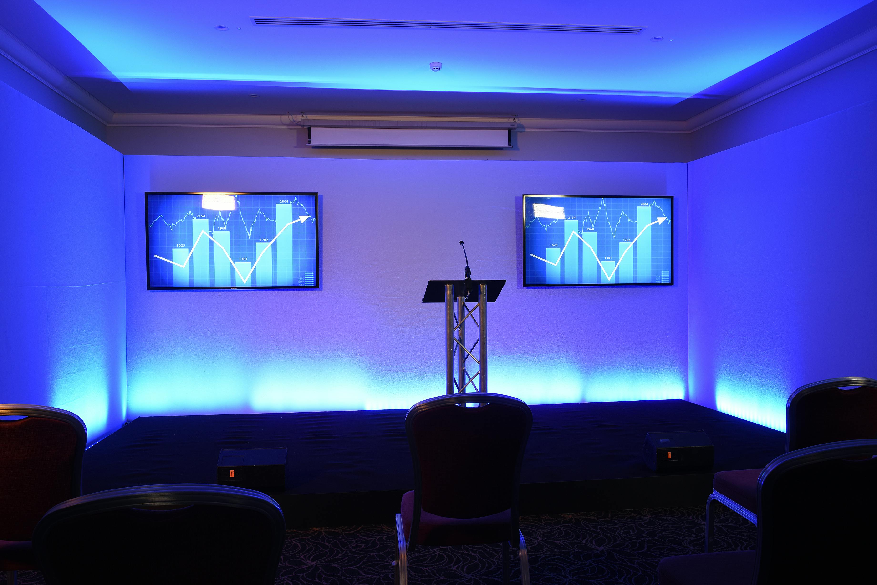 St James Suite at The Cavendish London with dual screens for corporate events.