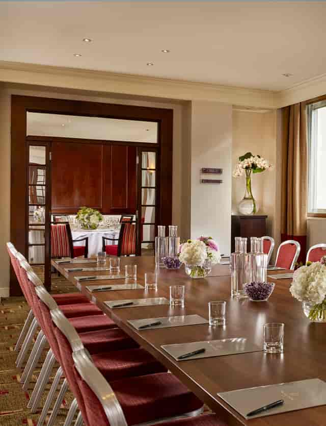 Piccadilly Suite at The Cavendish London, elegant meeting room with polished wooden table.