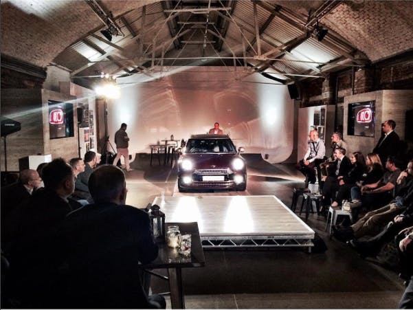 Sleek car on stage at Shoreditch Studios for a dynamic product launch event.