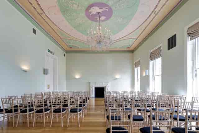 Elegant meeting room in Asia House with chandelier, perfect for corporate events.