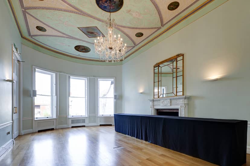 Elegant meeting room with chandelier, ideal for corporate events and private functions.