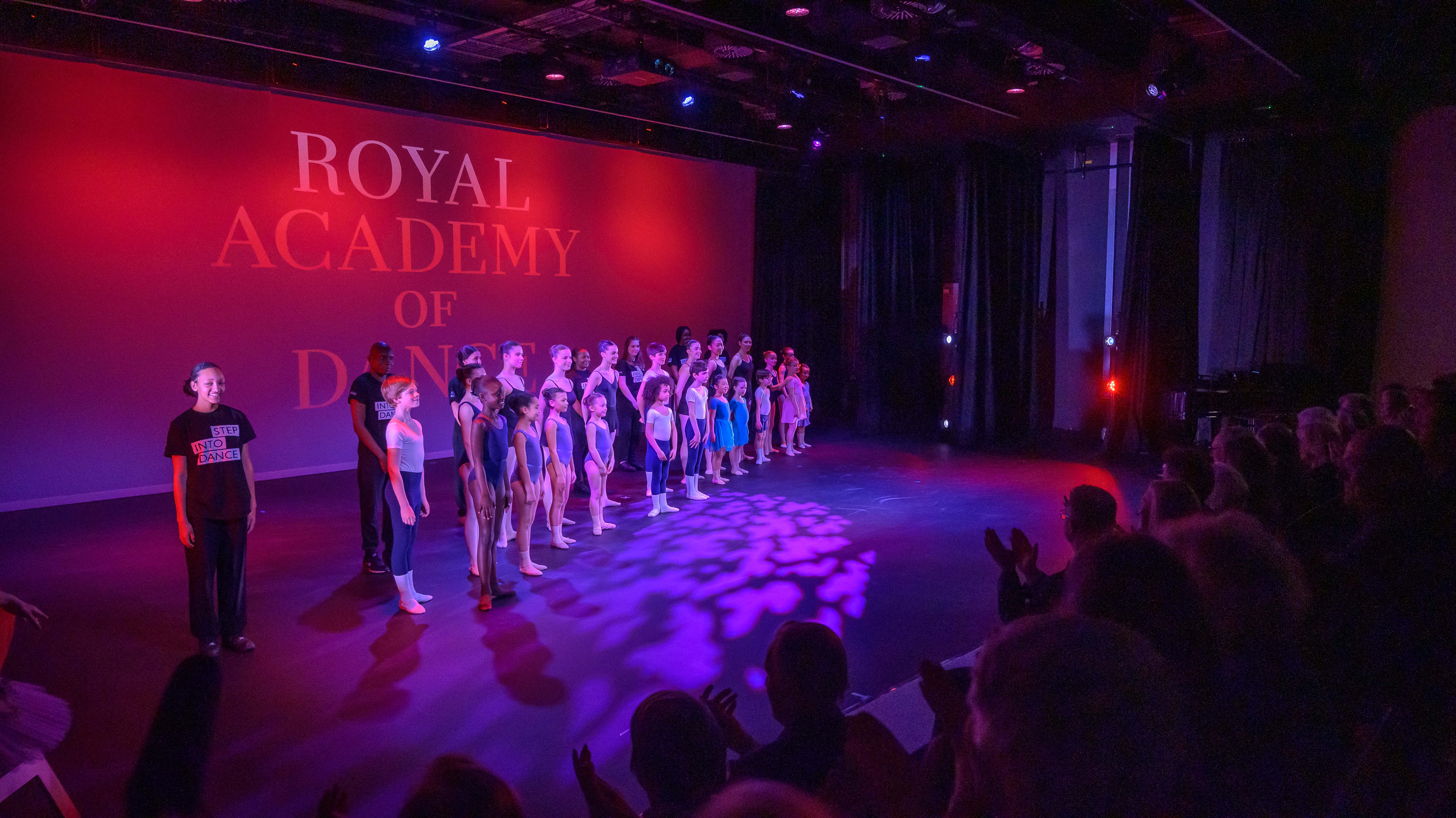 Aud Jebsen Studio Theatre with dancers performing for an engaged audience at a vibrant event. - Banner