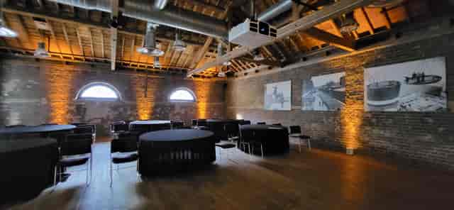 Quayside Room at London Museum Docklands, featuring exposed brick for events and meetings.