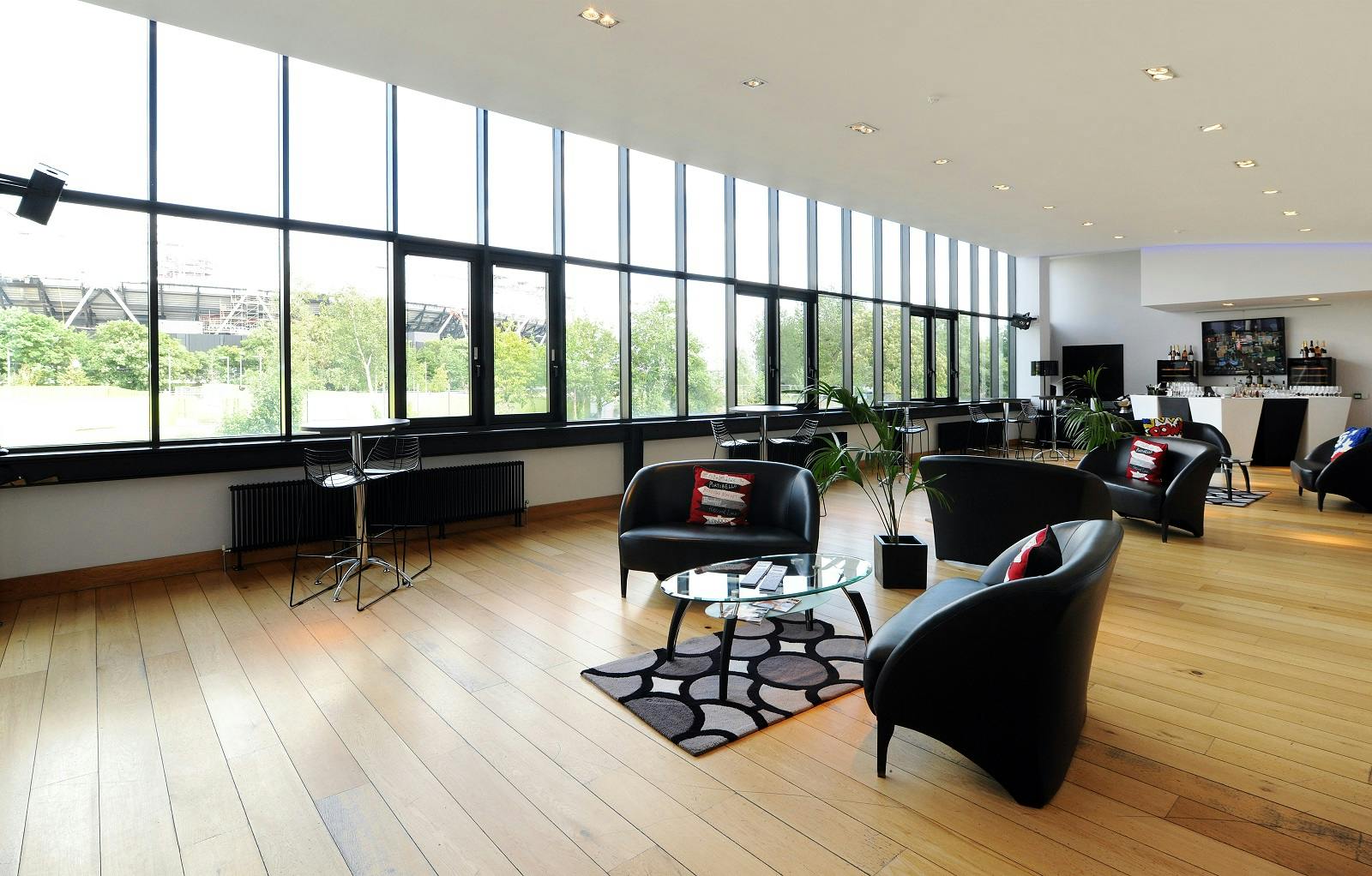 Modern event space with large windows, ideal for networking and gatherings.