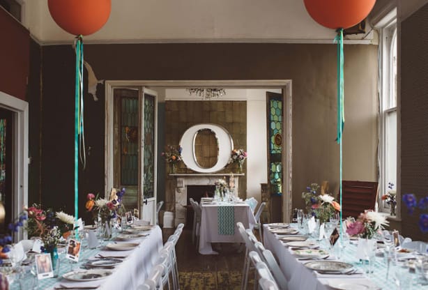 Intimate event banquet setup at The Roost with vertical balloon decor for weddings and parties.