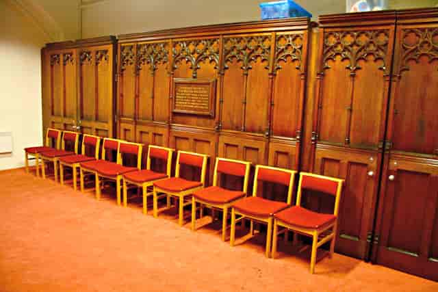 Historic boardroom at St Luke's Hackney, mismatched banquet chairs, event venue meeting room.
