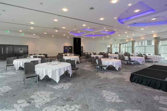 Grand Ballroom at The Lowry Hotel with stage, ideal for corporate conferences and luxury banquets.