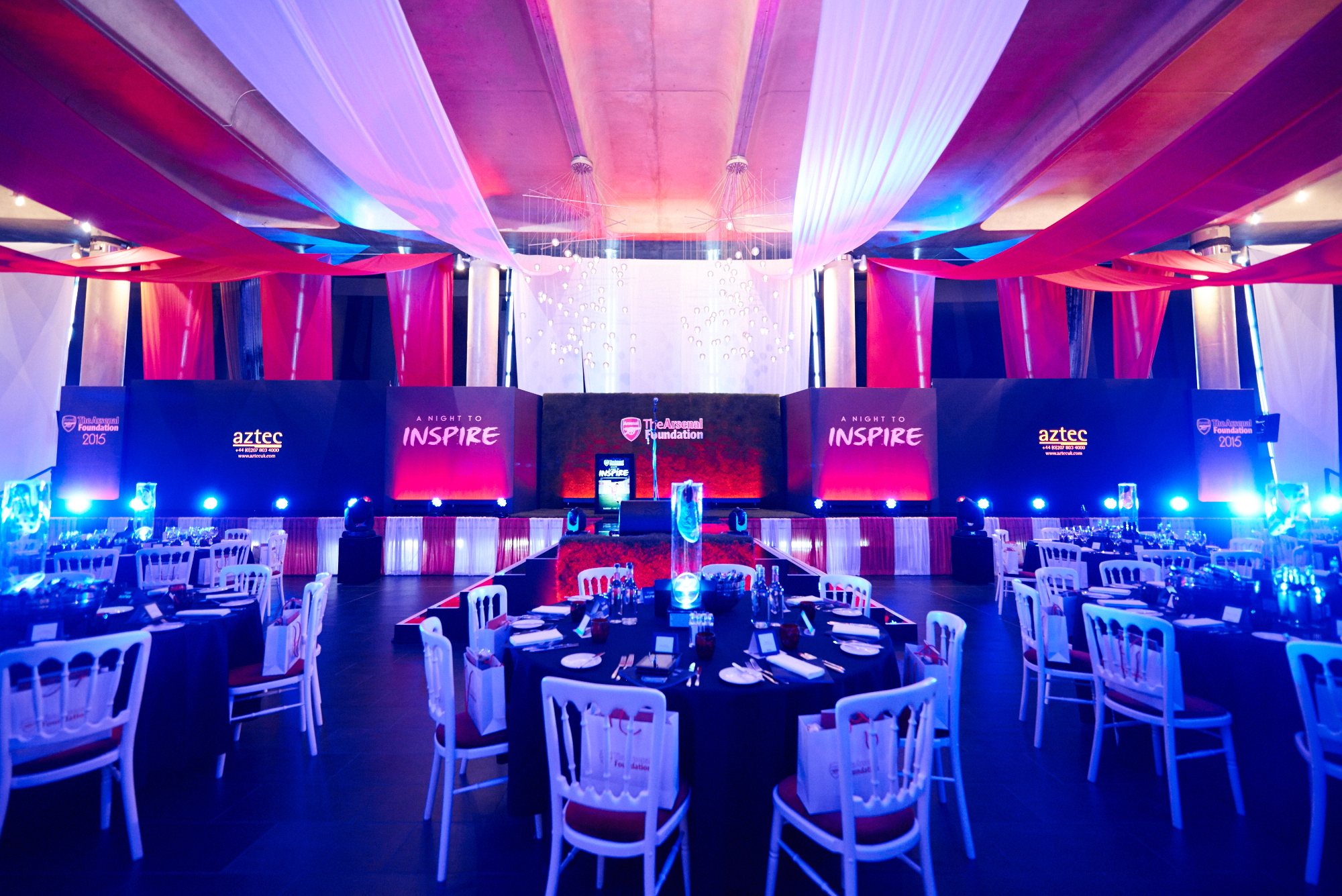 "Emirates Stadium event space with elegant tables, ideal for formal gatherings and presentations." - Banner