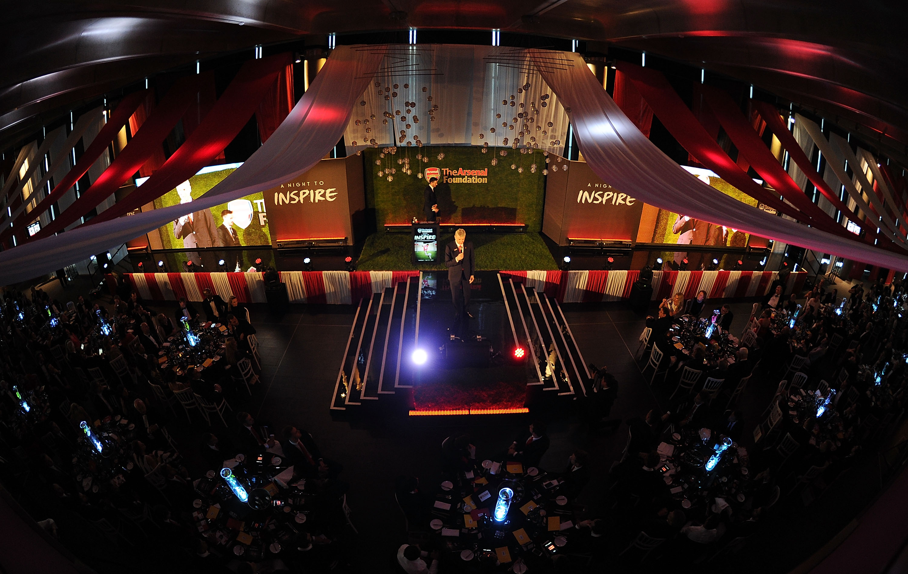 Emirates Stadium event space with vibrant lighting for networking and engagement. - Banner