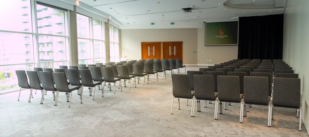 Half Ball Room at The Lowry Hotel with natural light, ideal for conferences and meetings.