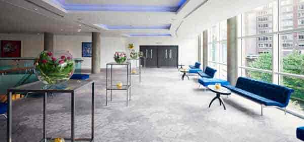 Modern event space with natural light for corporate meetings and social gatherings.
