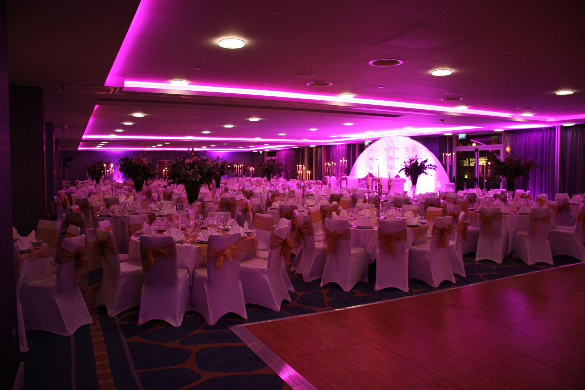 Grand Ballroom at Chelsea Harbour Hotel, elegant wedding venue with pink accents.