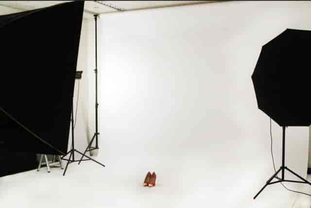 Minimalist studio setup with white backdrop for product launches and promotional events.