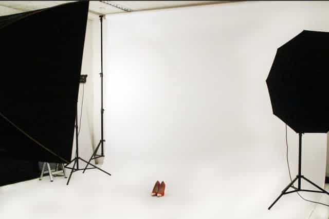 Minimalist studio setup with white backdrop for product launches and promotional events.