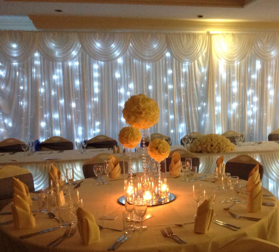 Elegant event space at The Yacht Club with floral centerpieces for weddings and corporate events. - Banner