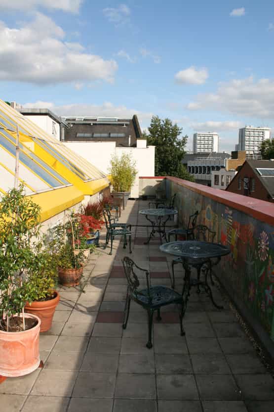 Pyramid Room rooftop terrace with greenery, ideal for casual meetings and networking events.