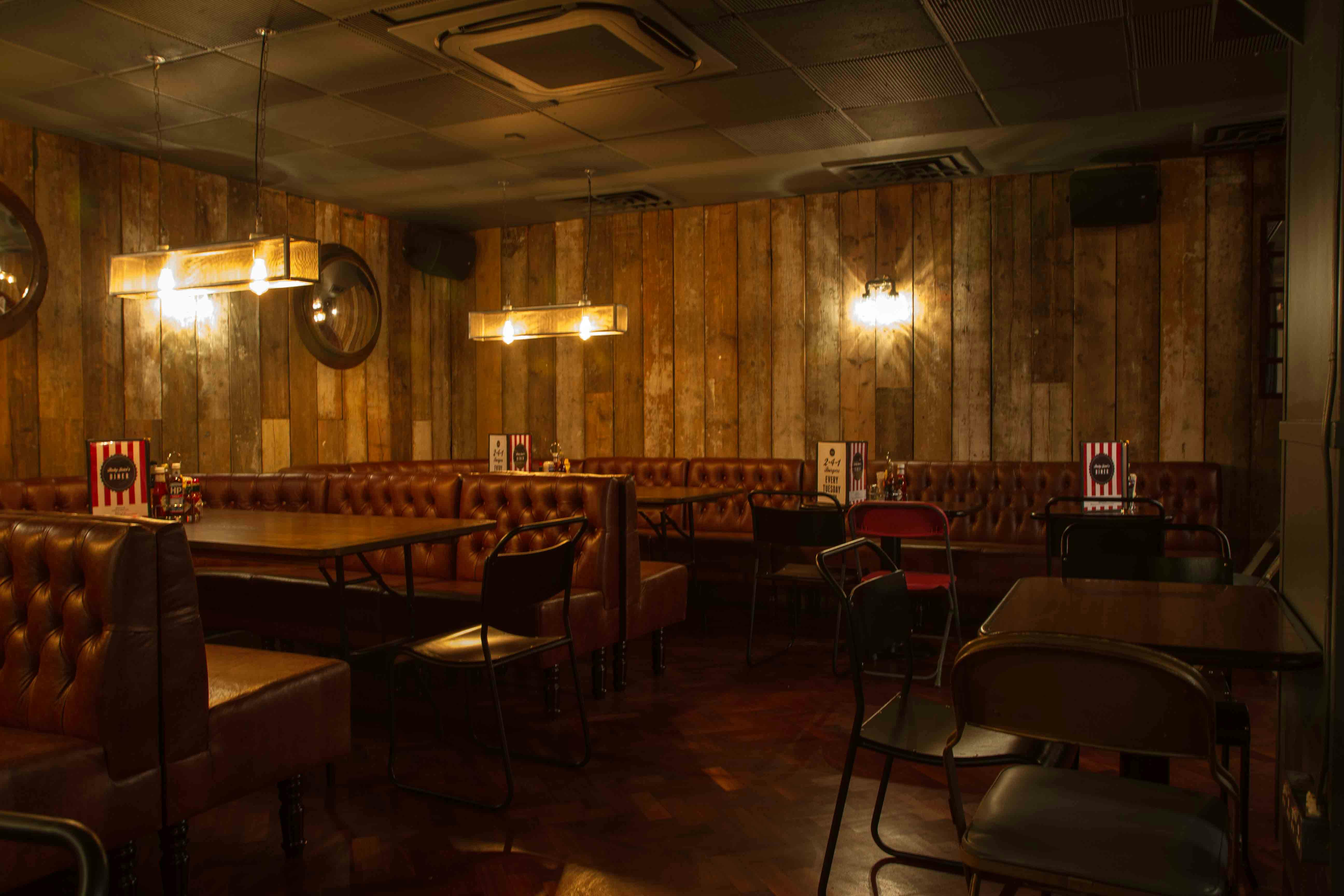 Cozy venue with warm wood paneling for intimate gatherings and private events.